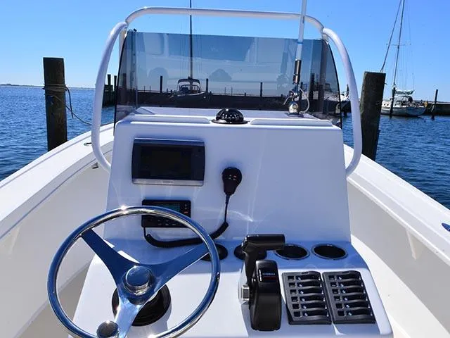 Slide: The Image of 2026 Steiger Craft 21 Tournament boat dashboard with steering wheel and controls. - 12