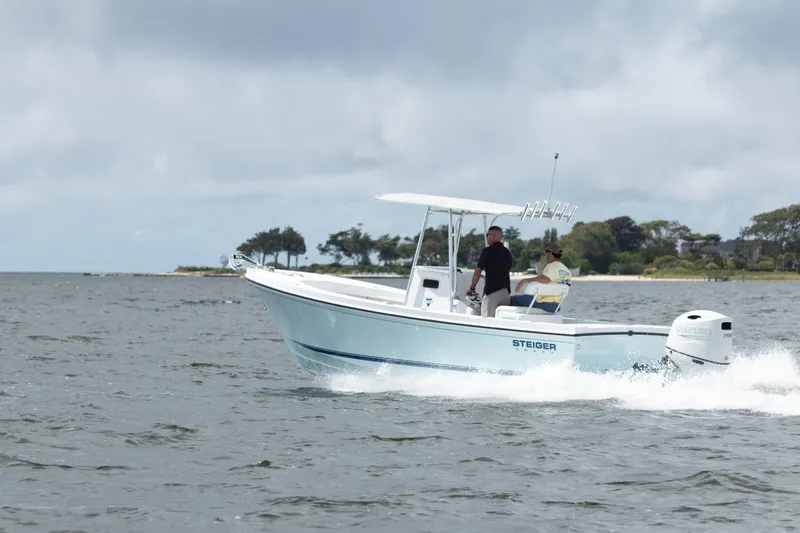 Slide: The Image of 2026 Steiger Craft 21 Tournament boat cruising on open water under cloudy skies. - 3