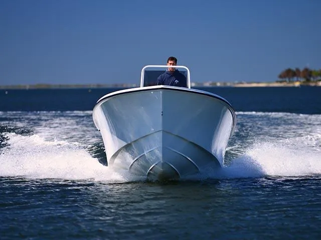 Slide: The Image of 2026 Steiger Craft 21 Tournament boat cruising on open water under clear blue sky. - 7