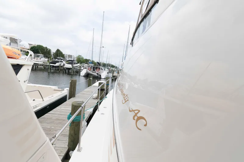 Slide: The Image of 2000 Sea Ray 420 Aft Cabin yacht docked at marina, side view. - 10