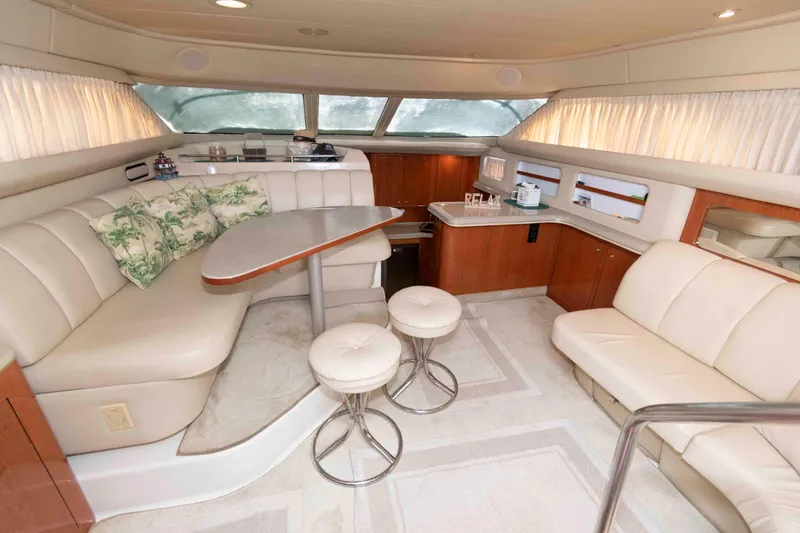 Slide: The Image of Luxurious interior of 2000 Sea Ray 420 Aft Cabin yacht with elegant seating and decor. - 11