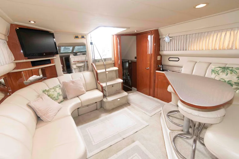 Slide: The Image of Luxurious interior of 2000 Sea Ray 420 Aft Cabin yacht with plush seating and modern amenities. - 14
