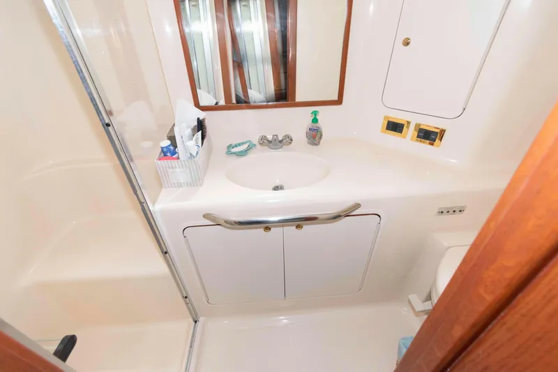 Slide: The Image of Bathroom interior of 2000 Sea Ray 420 Aft Cabin yacht with sink and mirror. - 19