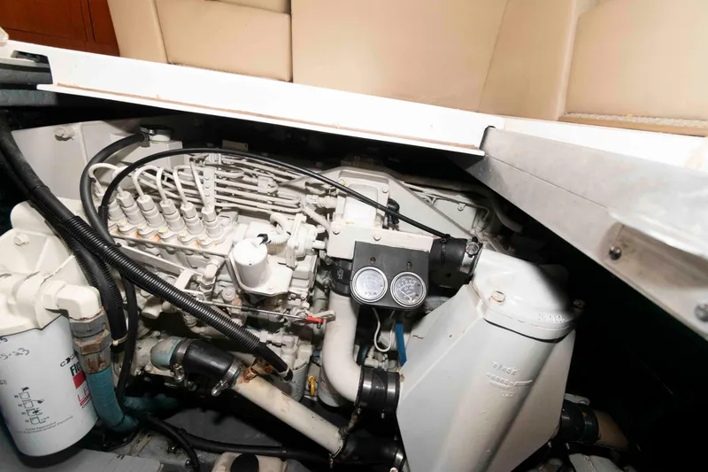 Slide: The Image of Engine compartment of 2000 Sea Ray 420 Aft Cabin boat, showcasing mechanical components. - 24