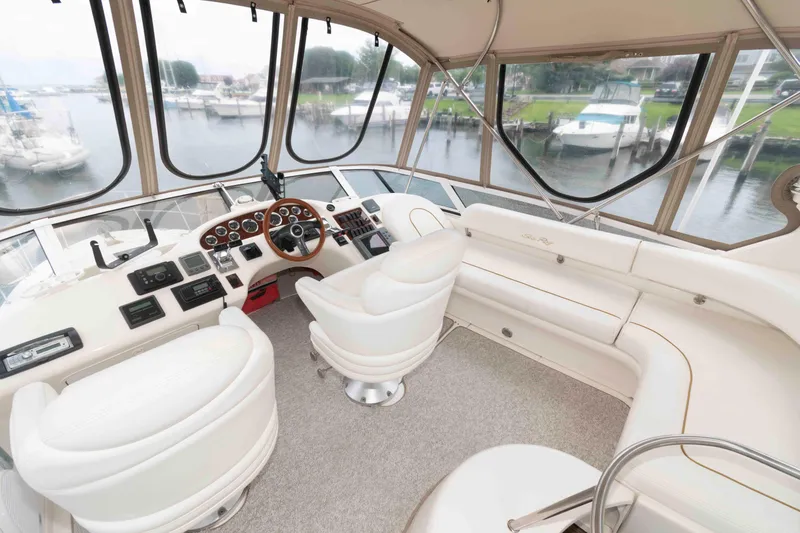 Slide: The Image of Interior view of 2000 Sea Ray 420 Aft Cabin yacht with helm and seating area. - 4