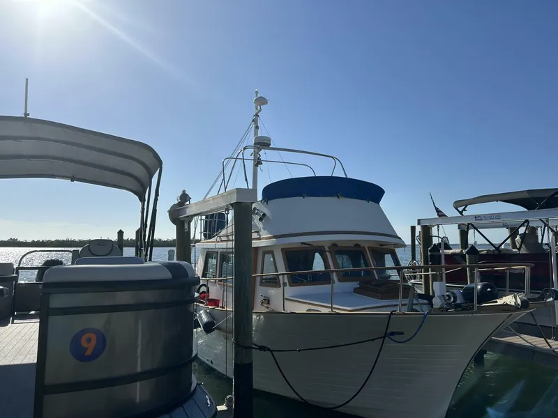 Slide: The Image of 1978 Albin 36 Trawler docked under clear blue sky. - 1