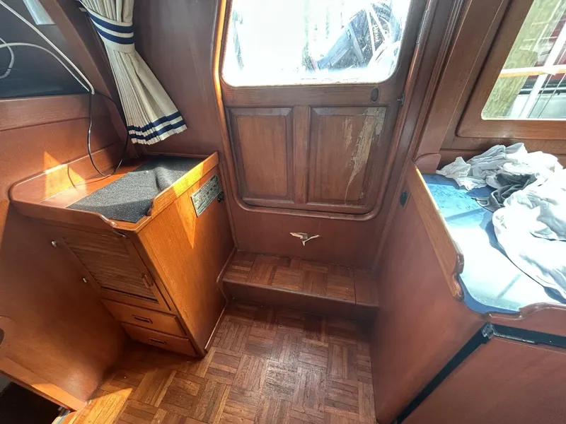 Slide: The Image of Interior of 1978 Albin 36 Trawler with wood paneling and nautical decor. - 15