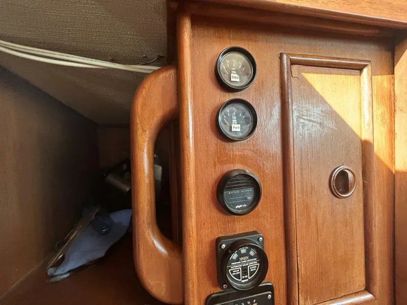 Slide: The Image of Wooden panel with gauges and controls on a 1978 Albin 36 Trawler. - 28