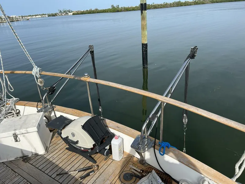 Slide: The Image of 1978 Albin 36 Trawler deck with grill and ropes, overlooking calm water. - 34