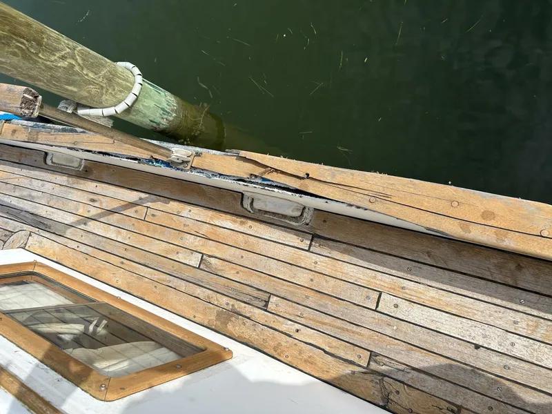 Slide: The Image of Wooden deck of a 1978 Albin 36 Trawler moored at a dock. - 47