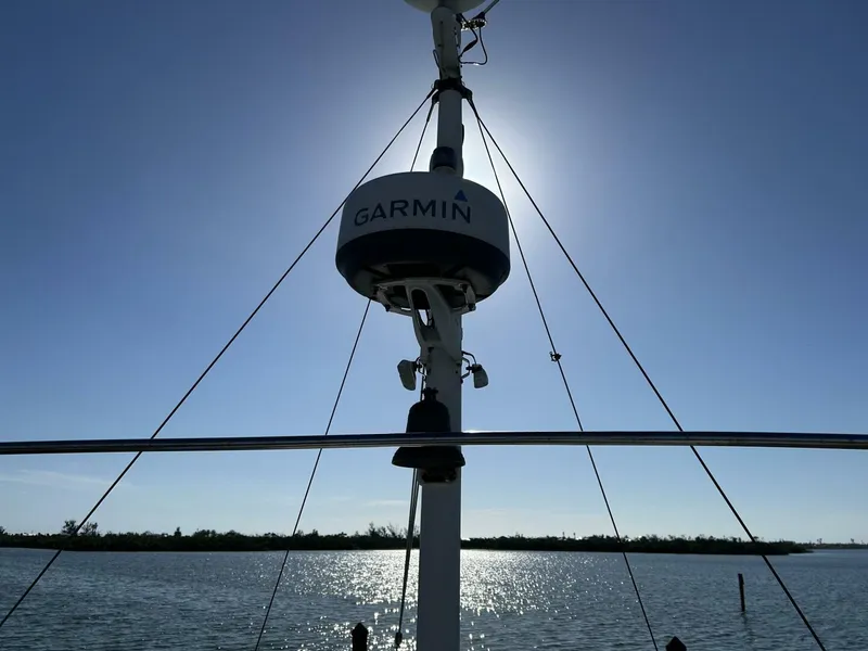 Slide: The Image of Albin 36 Trawler 1978 with Garmin radar against a bright sky and water backdrop. - 48