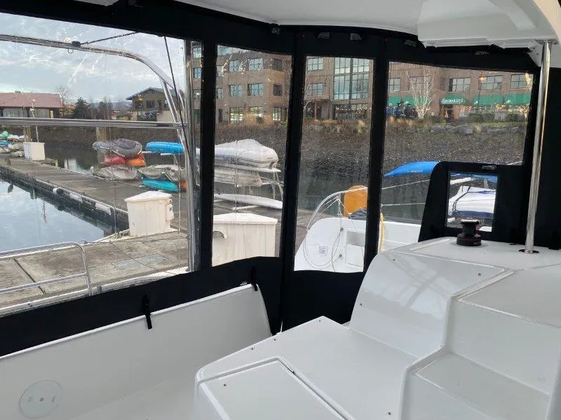 Slide: The Image of Interior view of 2024 Lagoon 42 catamaran at marina. - 30