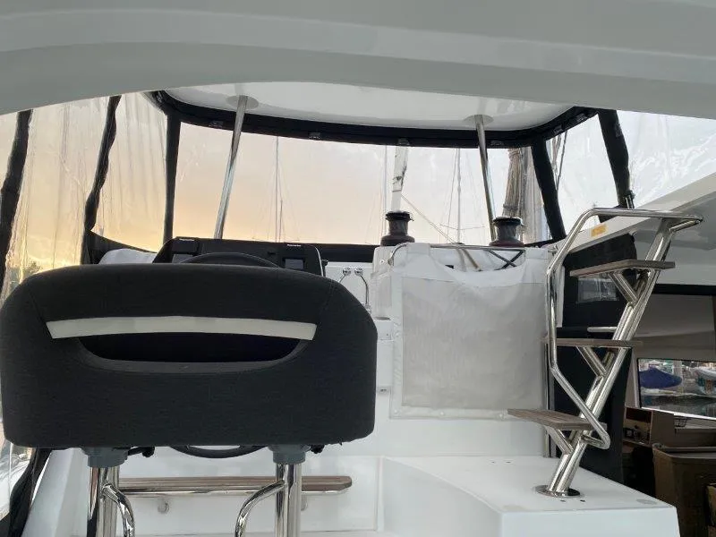 Slide: The Image of 2024 Lagoon 42 yacht cockpit with helm station and seating. - 31
