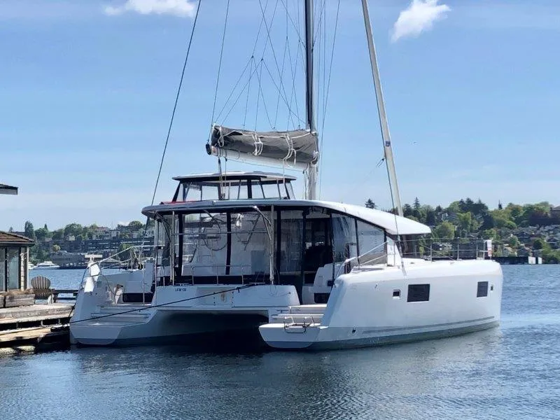 Slide: The Image of 2024 Lagoon 42 catamaran docked on a sunny day. - 33