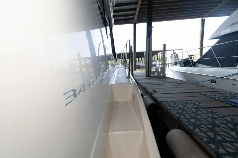 Slide: The Image of 2005 Silverton 34 Convertible yacht docked at marina, side view. - 10