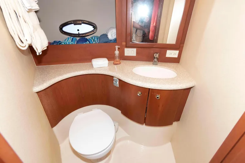 Slide: The Image of Bathroom interior of 2005 Silverton 34 Convertible yacht with sink and toilet. - 19