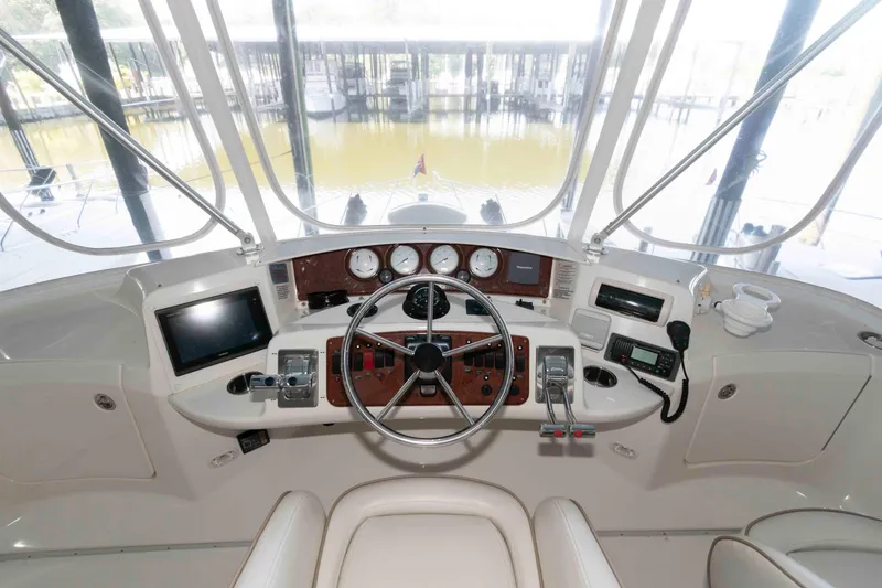 Slide: The Image of 2005 Silverton 34 Convertible yacht helm with steering wheel and navigation instruments. - 7