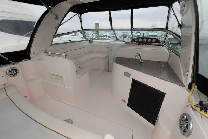 Slide: The Image of 2004 Rinker Fiesta Vee 342 boat interior with seating and kitchenette. - 3