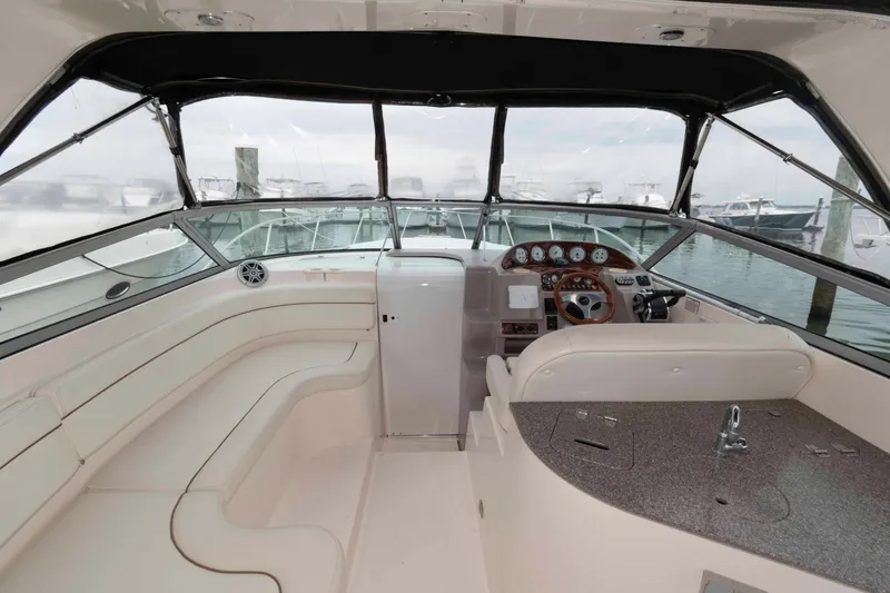 Slide: The Image of 2004 Rinker Fiesta Vee 342 boat interior with helm, seating, and dashboard. - 5