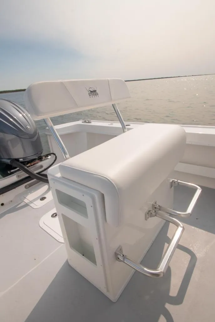 Slide: The Image of 2026 Steiger Craft 23 Chatham boat interior with seating and engine view. - 6