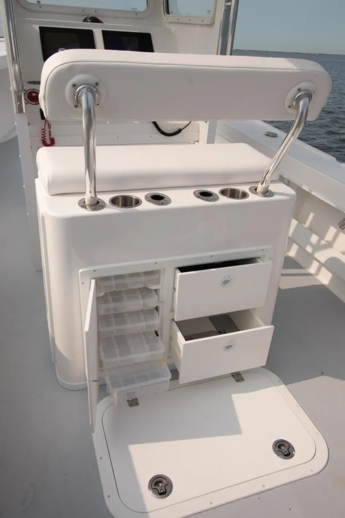 Slide: The Image of 2026 Steiger Craft 23 Chatham boat interior with storage compartments and seating. - 8