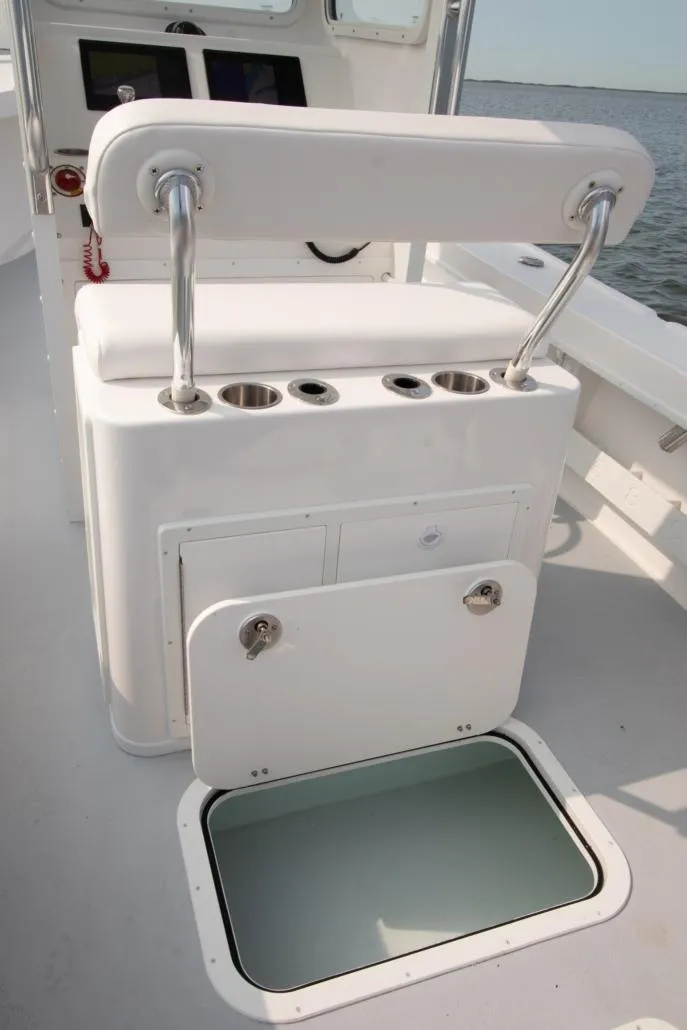 Slide: The Image of 2026 Steiger Craft 23 Chatham boat interior with seating and storage compartments. - 9