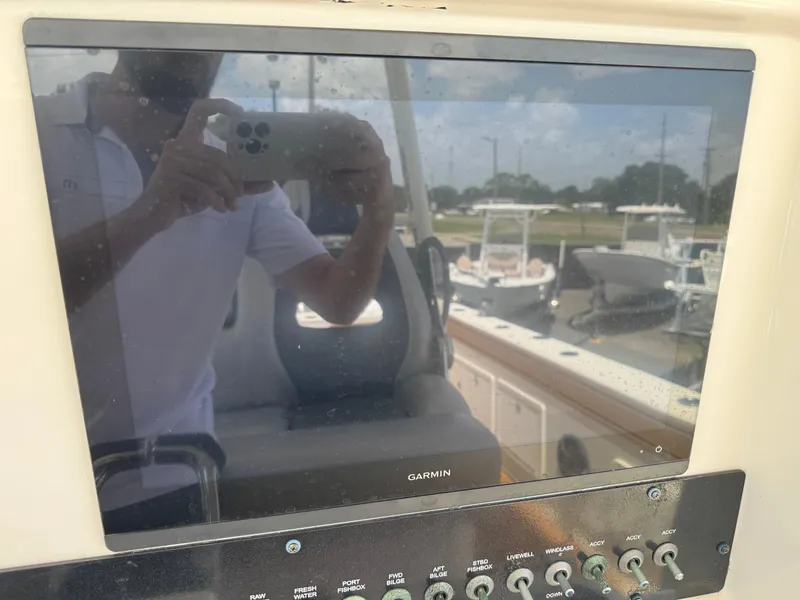 Slide: The Image of Control panel of a 2019 World Cat 3200 boat with Garmin display. - 13