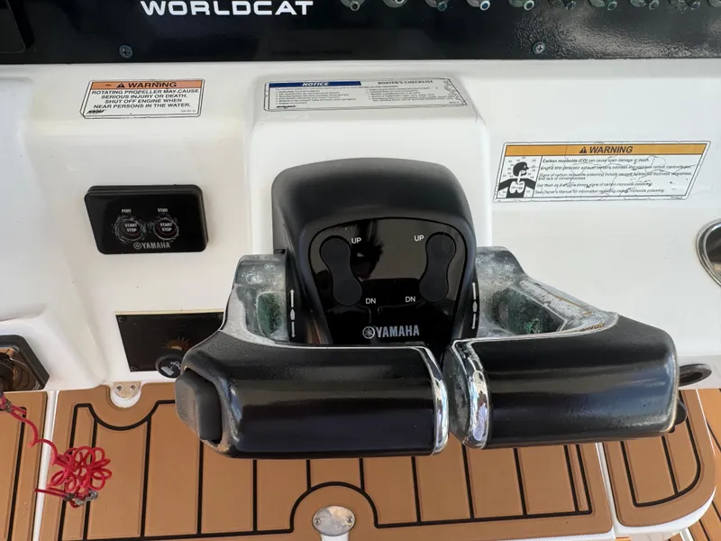 Slide: The Image of Yamaha throttle controls on a 2019 World Cat 3200 boat dashboard. - 20