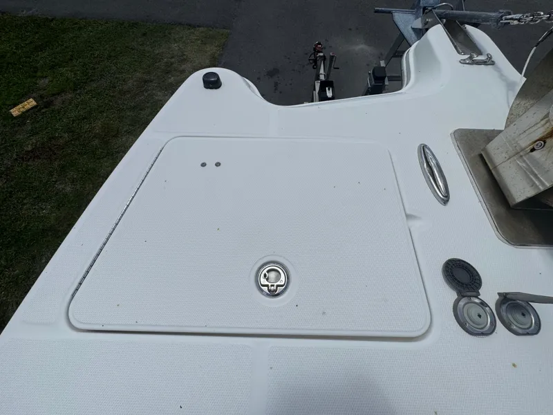 Slide: The Image of 2019 World Cat 3200 boat deck with storage hatch and fittings. - 29