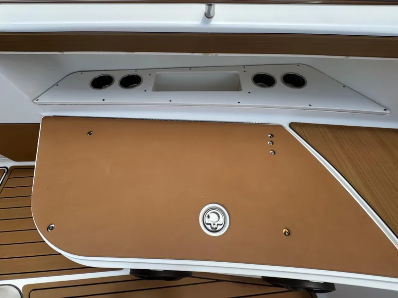 Slide: The Image of 2019 World Cat 3200 boat interior with tan and white paneling. - 33