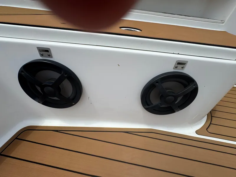 Slide: The Image of Speakers on a 2019 World Cat 3200 boat with teak flooring. - 38