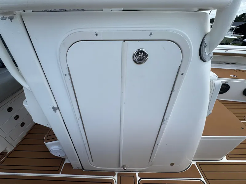 Slide: The Image of 2019 World Cat 3200 boat storage compartment with teak flooring. - 43