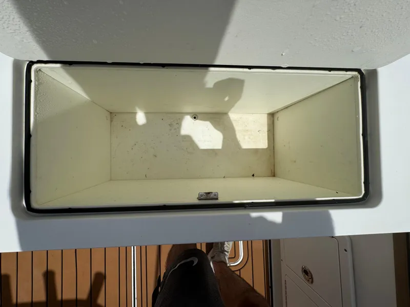 Slide: The Image of Open storage compartment on 2019 World Cat 3200 boat, viewed from above. - 54