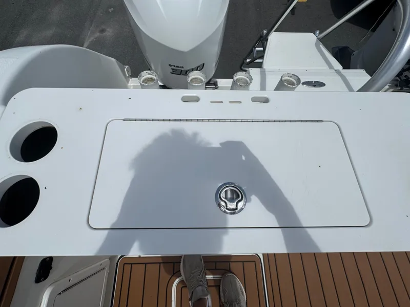 Slide: The Image of 2019 World Cat 3200 boat deck with Yamaha engine and fishing rod holders. - 55