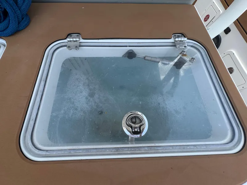 Slide: The Image of Livewell on 2019 World Cat 3200 boat with transparent lid and latch. - 64