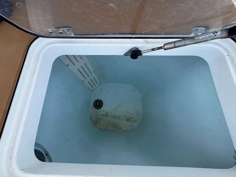 Slide: The Image of Open storage compartment in a 2019 World Cat 3200 boat. - 65