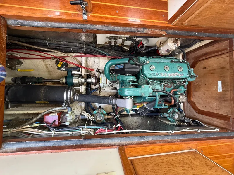 Slide: The Image of Engine compartment of a 1994 Pacific Seacraft Pilothouse 32 sailboat, featuring a Volvo Penta engine. - 20