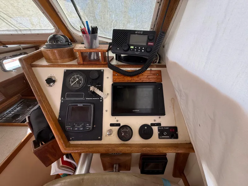 Slide: The Image of 1994 Pacific Seacraft Pilothouse 32 cockpit with navigation instruments and communication equipment. - 4