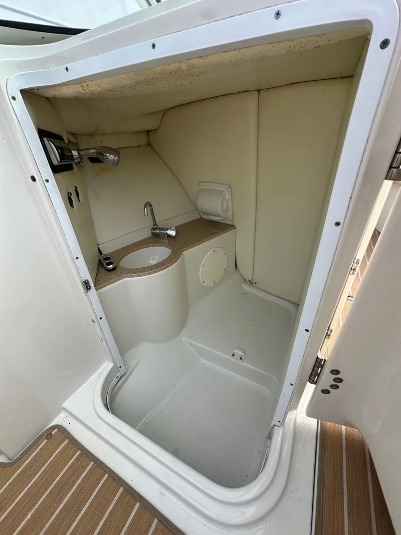 Slide: The Image of 2008 Chris-Craft Launch 25 boat interior with compact bathroom and sink. - 11
