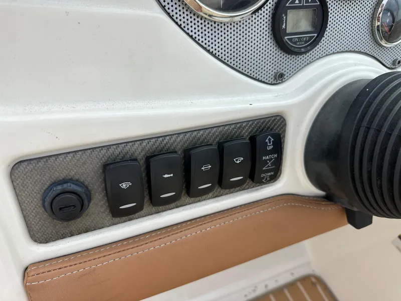 Slide: The Image of Dashboard controls of a 2008 Chris-Craft Launch 25 boat. - 15