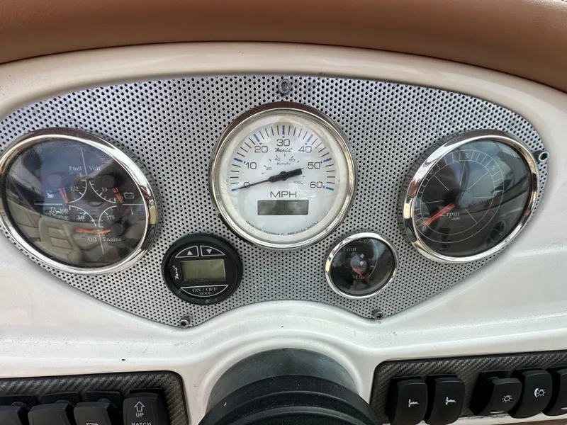 Slide: The Image of Dashboard of a 2008 Chris-Craft Launch 25 boat with gauges and controls. - 17