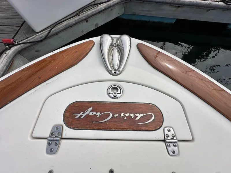 Slide: The Image of 2008 Chris-Craft Launch 25 boat stern with wood accents and logo detail. - 20