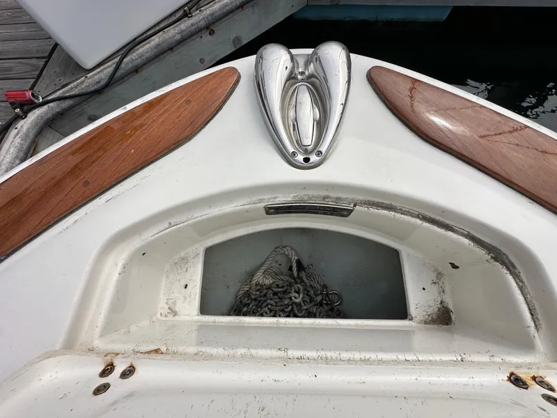 Slide: The Image of 2008 Chris-Craft Launch 25 anchor storage with wooden accents and metal fittings. - 21