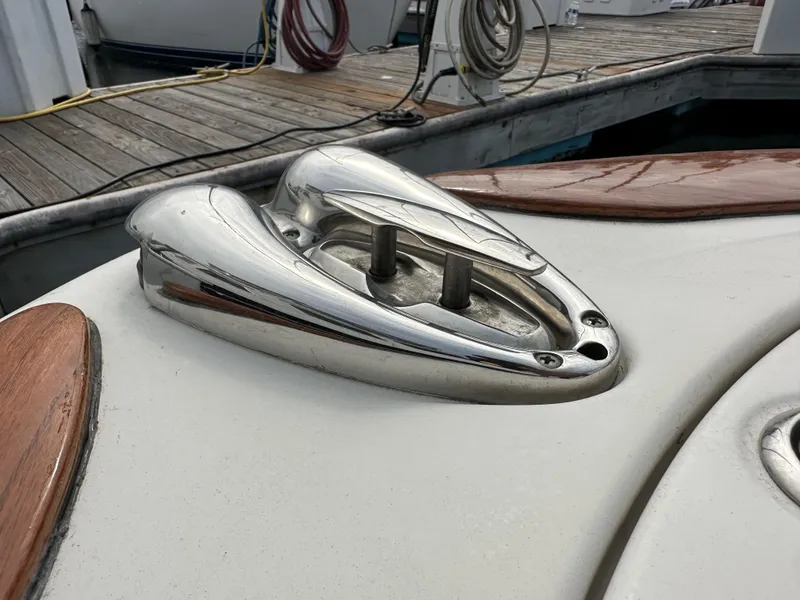 Slide: The Image of 2008 Chris-Craft Launch 25 boat detail with chrome hardware and wooden accents at dock. - 22