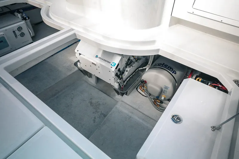 Slide: The Image of Engine compartment of 2027 Lindell 41' boat featuring Seakeeper 3 stabilizer and Isotemp water heater. - 12