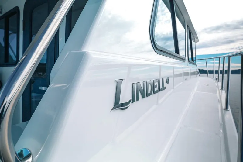Slide: The Image of 2027 Lindell 41' yacht with sleek design and modern features on open water. - 13