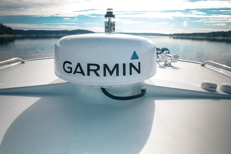 Slide: The Image of Garmin radar on 2027 Lindell 41' boat, cruising on a serene lake. - 17
