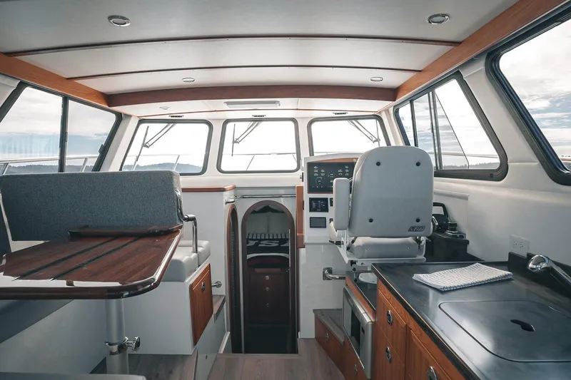 Slide: The Image of Interior of 2027 Lindell 41' boat with modern helm and seating area. - 23