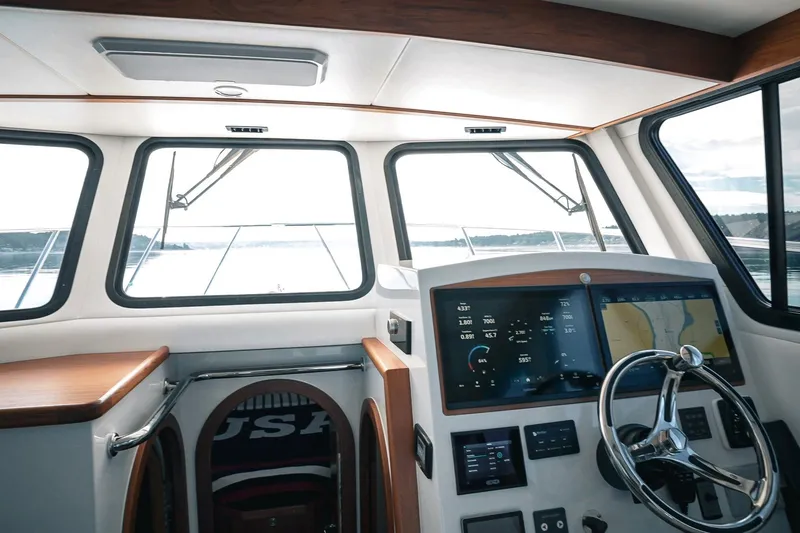 Slide: The Image of Interior view of 2027 Lindell 41' boat cockpit with modern navigation system. - 24