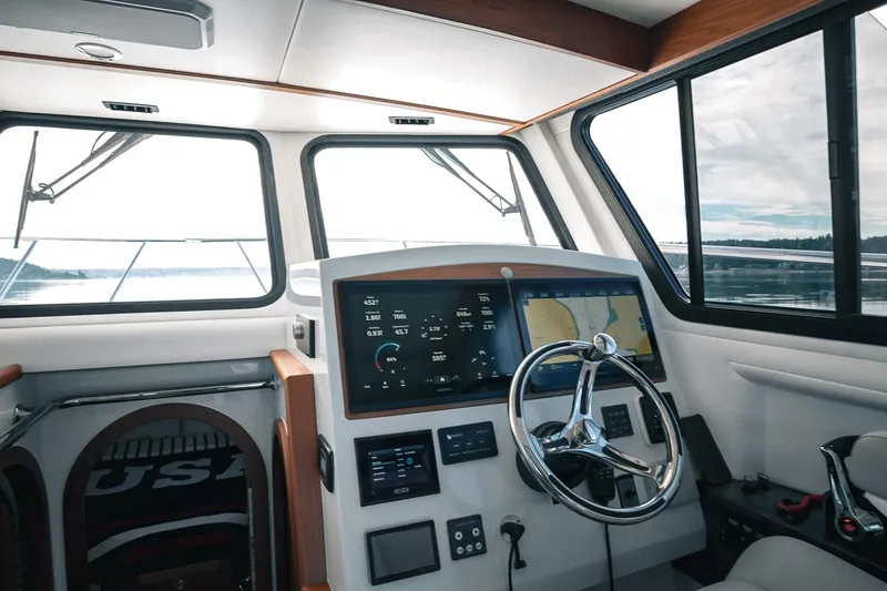 Slide: The Image of Interior view of 2027 Lindell 41' boat cockpit with modern navigation system. - 25